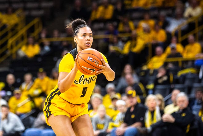 Iowa guard Alexis Sevillian (5) makes a 3-point basket during a NCAA college Big Ten Conference women's basketball game, Thursday, Jan. 9, 2020, at Carver-Hawkeye Arena in Iowa City, Iowa.
