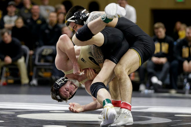 Purdue's Nate Limmex wrestles Iowa's Pat Lugo during a 149 pound bout in a Big Ten dual wrestling match, Sunday, Jan. 12, 2020 at Holloway Gymnasium in West Lafayette.