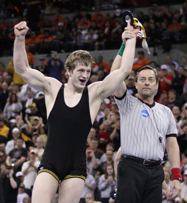 Iowa's Jay Borschel celebrates after defeating Cornell's Mack Lewnes in the 174-pound championship match during the 2010 NCAA Wrestling Championships in Omaha.