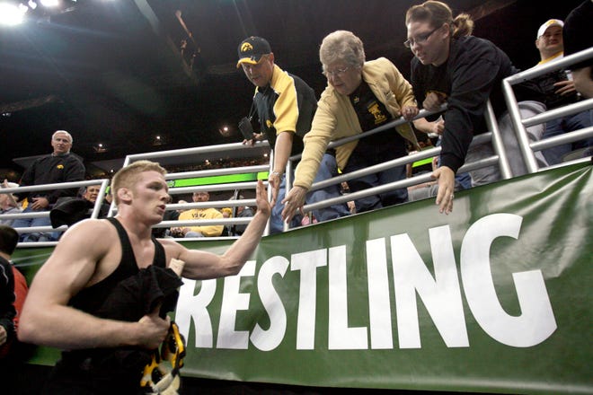 Iowa's Ryan Morningstar is congratulated by Hawkeyes fans as he leaves the mat after defeating Old Dominion Chris Brown in the seventh place at 165 pounds during the 2010 NCAA Wrestling Championships in Omaha.