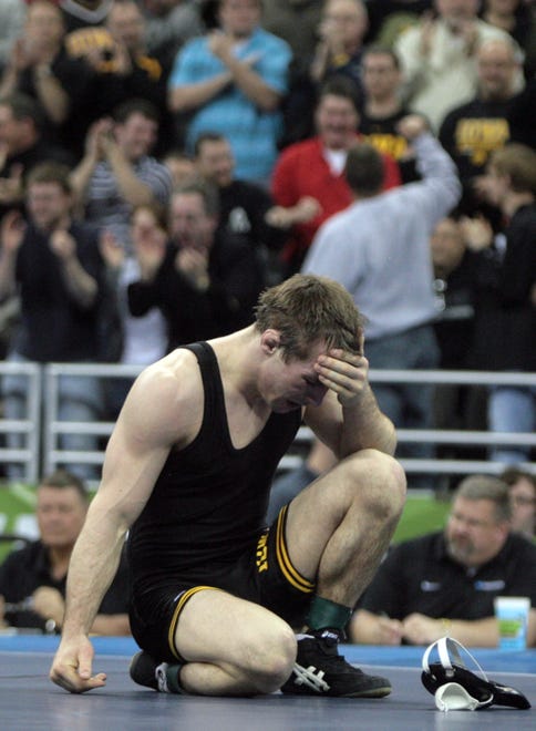 Iowa's Daniel Dennis reacts after losing to Minnesota's Jayson Ness in the 133-pound final of the 2010 NCAA Wrestling Championships in Omaha. Dennis was one of five Hawkeyes to wrestle for a championship — three won titles.