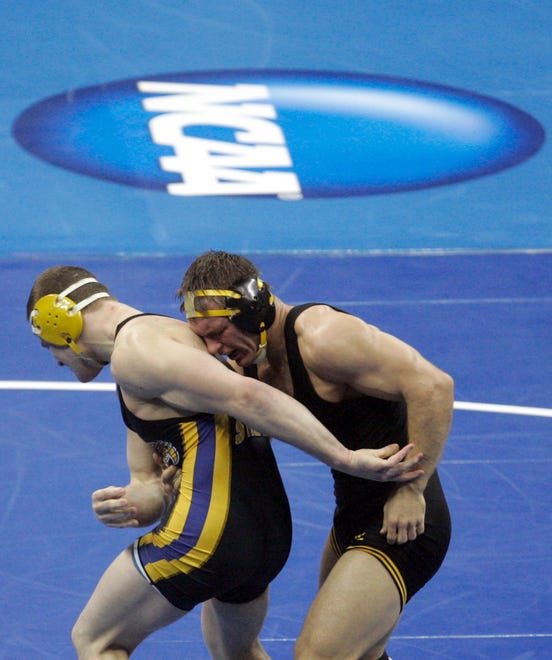Iowa's Phillip Keddy wrestles Kent State's Dustin Kilgore in their 184-pound match for seventh place during the 2010 NCAA Wrestling Championships in Omaha. Kilgore won 9-5.