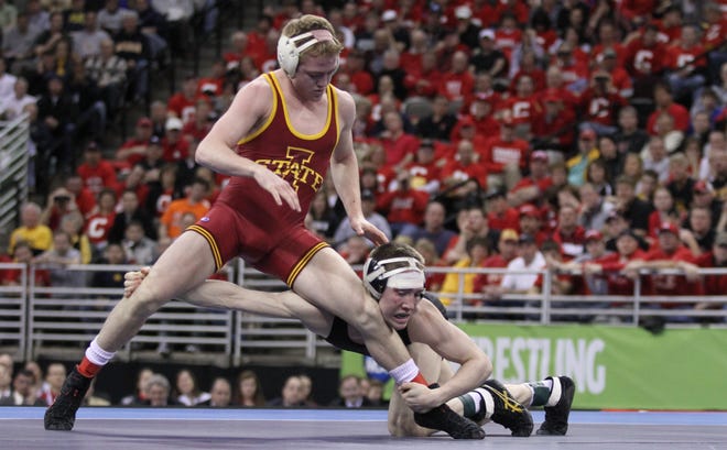 Iowa State's Andrew Long battles 

Iowa's Matt McDonough, right, scrambles to control Iowa State's Andrew Long in the 125-pound championship match during the 2010 NCAA Wrestling Championships in Omaha. McDonough claimed a 3-1 decision and was one of three Hawkeyes to win individual championships.