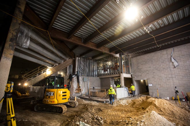 Workers prepare the area in the loading dock as construction continues during a tour of the site, Friday, Jan. 24, 2020, at the Xtream Arena in Coralville, Iowa.