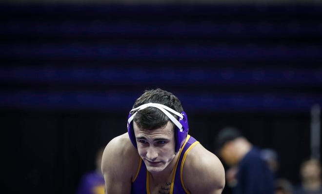 Northern Iowa's Michael Blockhus stares at the Oklahoma State bench prior to the start of his match at 141 pounds against Dusty Hone on Saturday, Jan. 25, 2020, at the McCleod Center in Cedar Falls.