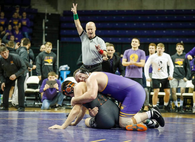 Northern Iowa's Carter Isley scores a third period takedown on Oklahoma State's Austin Harris in their match at 285 pounds on Saturday, Jan. 25, 2020, at the McCleod Center in Cedar Falls.