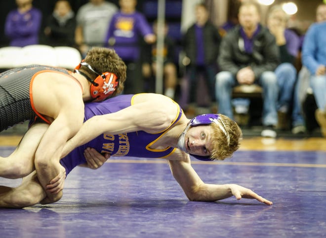 Northern Iowa's Jack Skudlarczyk, right, fights to get away from Oklahoma State's Reece Witcraft in their match at 133 pounds on Saturday, Jan. 25, 2020, at the McCleod Center in Cedar Falls.