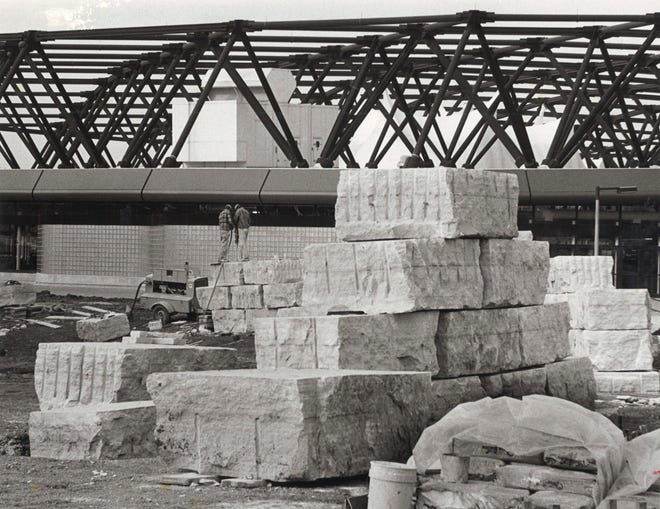 Sculptures of stacked blocks are assembled on the south side of the building in November of 1983, at Carver-Hawkeye Arena in Iowa City, Iowa.