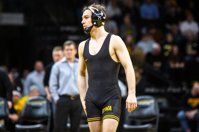 Iowa's Spencer Lee walks out to the mat for a match at 125 pounds during a NCAA Big Ten Conference wrestling dual, Saturday, Feb. 15, 2020, at Carver-Hawkeye Arena in Iowa City, Iowa.