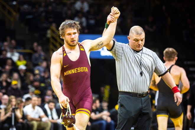 Minnesota's Owen Webster has his hand after winning a match at 184 pounds during a NCAA Big Ten Conference wrestling dual, Saturday, Feb. 15, 2020, at Carver-Hawkeye Arena in Iowa City, Iowa.