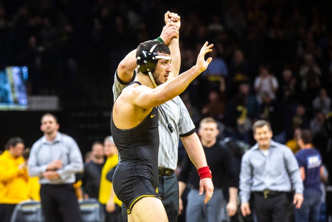 Iowa's Michael Kemerer waves to fans after scoring a fall during a NCAA Big Ten Conference wrestling dual against Minnesota, Saturday, Feb. 15, 2020, at Carver-Hawkeye Arena in Iowa City, Iowa.
