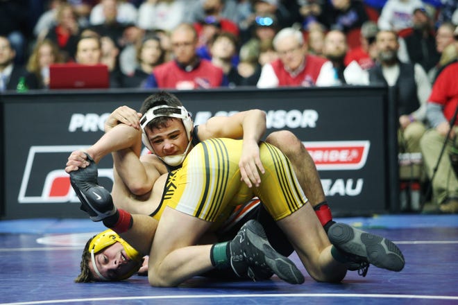 Solon's Hayden Taylor wrestles Eddyville-Blakesburg-Fremont's Trestin Sales during the 145 pound Class 2A championship match during the Iowa high school state wrestling tournament on Saturday, Feb. 22, 2020, at Wells Fargo Arena, in Des Moines.