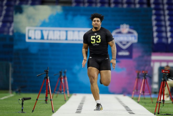 Iowa offensive lineman Tristan Wirfs runs the 40-yard dash at the NFL football scouting combine in Indianapolis, Friday, Feb. 28, 2020.