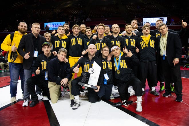The Iowa wrestling team poses after winning the Big 10 Wrestling Championships outright. March 8, 2020; Piscataway, NJ, USA.