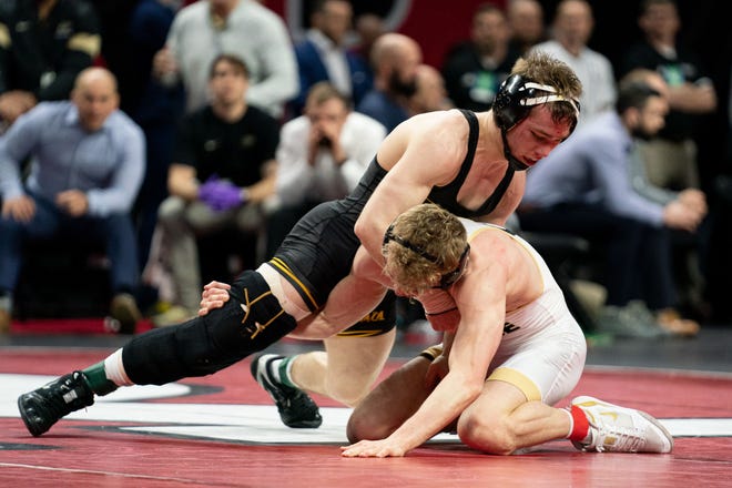 Iowa's Spencer Lee wrestles with Purdue's Devin Schroder for the 125-pound title at the Big 10 Wrestling Championships March 8, 2020.