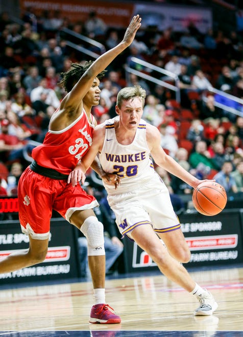 Waukee's Payton Sandfort drives to the basket as North Scott's Tytan Anderson defends during the 4A state basketball quarterfinal matchup at Wells Fargo Arena Tuesday, March 10, 2020.