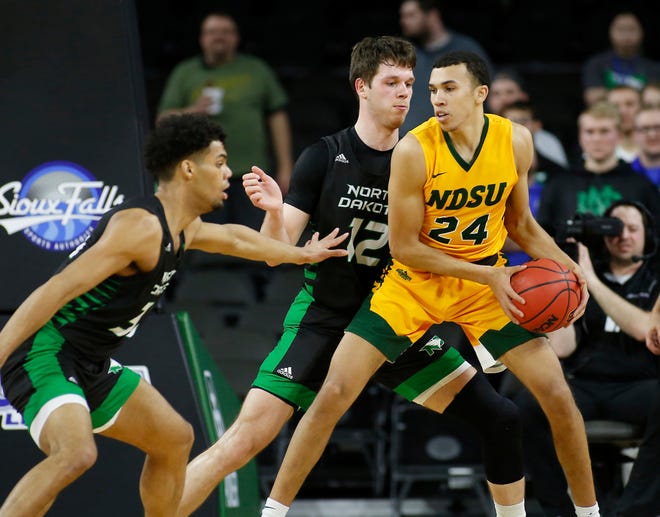 SIOUX FALLS, SD - MARCH 10: Tyson Ward #24 of the North Dakota State Bison drives into Filip Rebraca #12 of the North Dakota Fighting Hawks during the men’s championship game at the 2020 Summit League Basketball Tournament in Sioux Falls, SD. (Photo by Richard Carlson/Inertia)