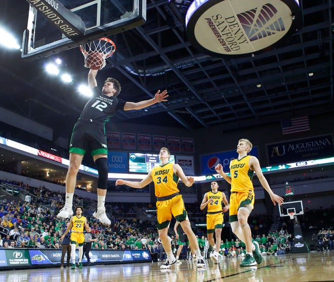 SIOUX FALLS, SD - MARCH 10: Filip Rebraca #12 of the North Dakota Fighting Hawks dunks past North Dakota State Bison defenders during the men’s championship game at the 2020 Summit League Basketball Tournament in Sioux Falls, SD. (Photo by Richard Carlson/Inertia)