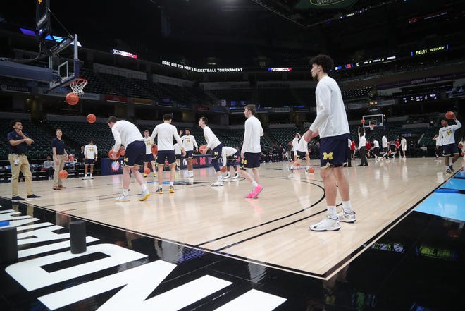 The Michigan Wolverines and Rutgers Scarlet Knights warm up before their first round Big Ten tournament game at Bankers Life Fieldhouse in Indianapolis, Indiana was canceled due to the Coronavirus Pandemic Thursday, March 12, 2020.