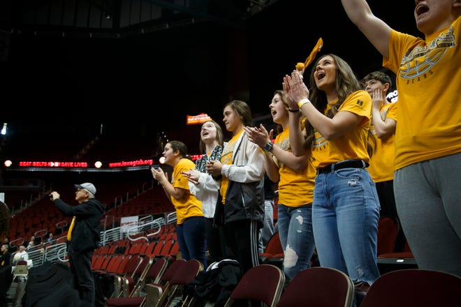 Only family and essential personnel watch the 1A state boys basketball championship game between Wapsie Valley and Bishop Garrigan on Friday, March 13, 2020, in Des Moines.