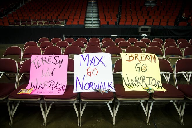 Signs for the 3A game sit in the stands during the 2A state boys basketball championship game at Wells Fargo Arena on Friday, March 13, 2020, in Des Moines. Boyden-Hull would go on to beat North Linn 64-51 to win the 2A championship.