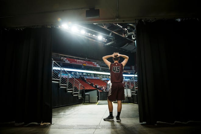 North Linn's Jake Kurt (45) takes one last look at the court after the Lynx lost 51-64 to Boyden-Hull during their 2A state boys basketball championship game at Wells Fargo Arena on Friday, March 13, 2020, in Des Moines.