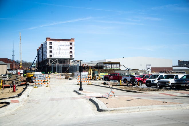 Construction continues at the Staybridge Suites Hotel attached to the Xtream Arena, Friday, April 10, 2020, in Coralville, Iowa.