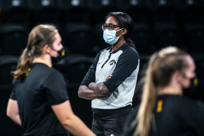 Iowa volleyball head coach Vicki Brown watches players warm up during a practice, Thursday, Sept. 17, 2020, at the Xtream Arena in Coralville, Iowa.
