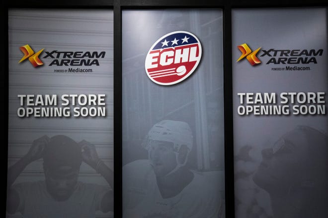 Signs for a team store on the concourse for teams in the arena, including a newly announced ECHL hockey team are seen, Thursday, Sept. 17, 2020, at the Xtream Arena in Coralville, Iowa.