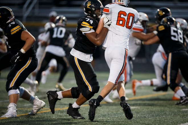 Southeast Polk's Kadyn Proctor (74) blocks during their football game at Southeast Polk on Friday, Sept. 18, 2020 in Pleasant Hill.