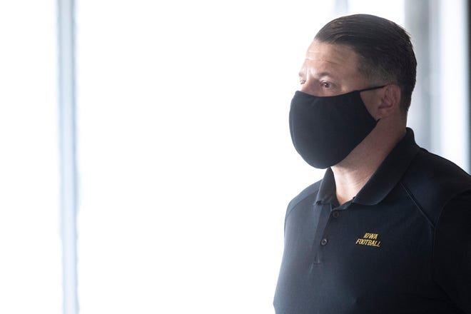 Iowa offensive coordinator Brian Ferentz wears a facemask during a Hawkeye football media day news conference, Thursday, Oct. 8, 2020, at Kinnick Stadium in Iowa City, Iowa. Reporters were required to wear face masks and sat apart from each other amid the novel coronavirus pandemic.