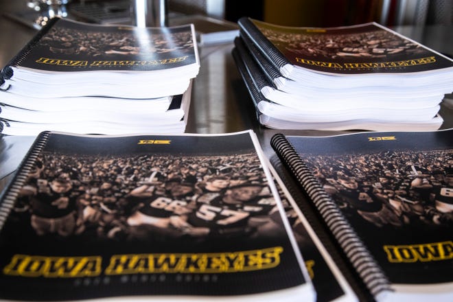 Iowa football media guides are seen during a Hawkeye football media day news conference, Thursday, Oct. 8, 2020, at Kinnick Stadium in Iowa City, Iowa.