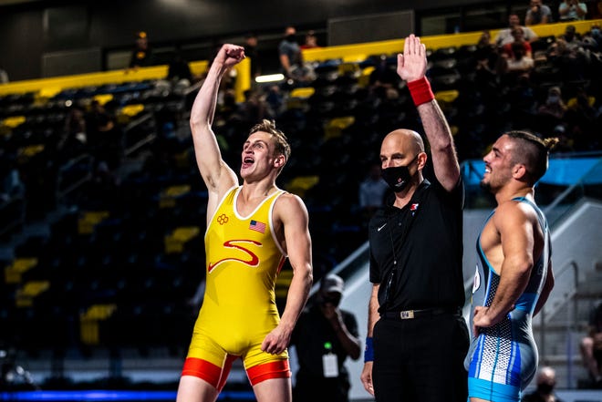 Benji Peak, left, celebrates after beating Calvin Germinaro in the 57kg final during the USA Wrestling Senior National Championships, Friday, Oct. 9, 2020, at the Xtream Arena in Coralville, Iowa.