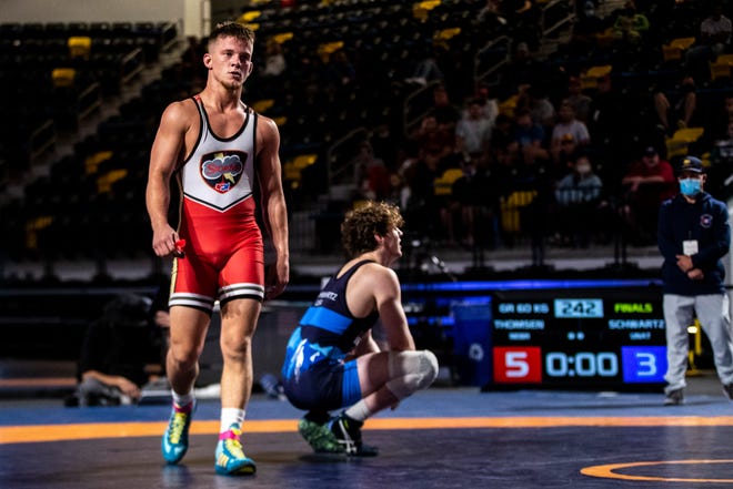 Alex Thomsen, left, reacts after beating Mosha Schwartz in the 60kg final during the USA Wrestling Senior National Championships, Friday, Oct. 9, 2020, at the Xtream Arena in Coralville, Iowa.