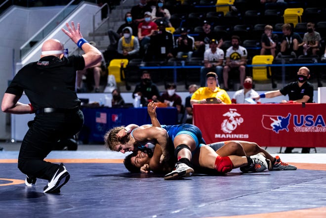 Lauren Louive, left, scores a fall on Xochitl Mota-Pettis in the 57kg final during the USA Wrestling Senior National Championships, Friday, Oct. 9, 2020, at the Xtream Arena in Coralville, Iowa.