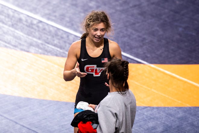 Emma Cochran, left, talks with a teammate after a match at 50 kg during the USA Wrestling Senior National Championships, Friday, Oct. 9, 2020, at the Xtream Arena in Coralville, Iowa.