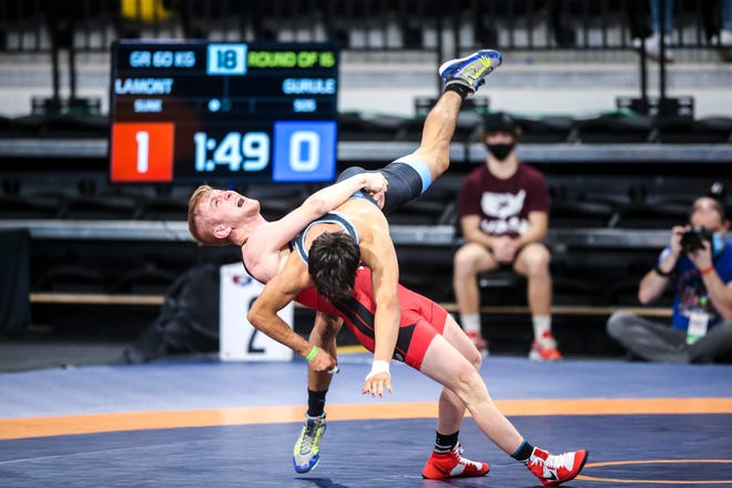 Tyler Lamont, left, suplexes Jonathan Gurule while they wrestle at 60 kg during the USA Wrestling Senior National Championships, Friday, Oct. 9, 2020, at the Xtream Arena in Coralville, Iowa.