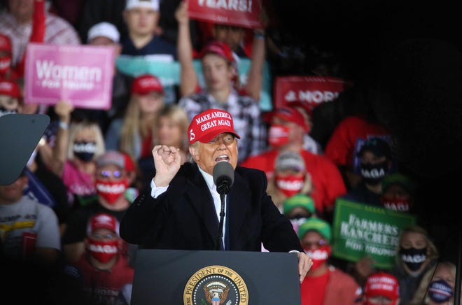 U.S. President Donald Trump speaks at the Des Moines International Airport during a rally in Iowa on Wednesday, Oct. 14, 2020.