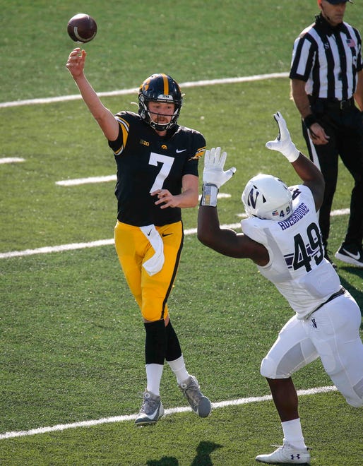 Iowa sophomore quarterback Spencer Petras fires a throw against Northwestern at Kinnick Stadium in Iowa City on Saturday, Oct. 31, 2020.