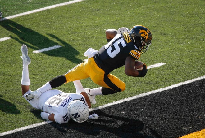 Iowa sophomore running back Tyler Goodson rumbles into the end zone in the first quarter against Northwestern at Kinnick Stadium in Iowa City on Saturday, Oct. 31, 2020.