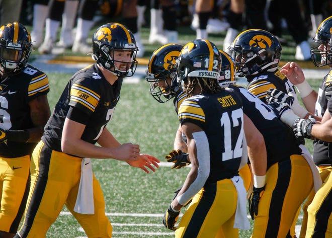 Iowa sophomore quarterback Spencer Petras calls a play in the huddle in the first quarter against Northwestern at Kinnick Stadium in Iowa City on Saturday, Oct. 31, 2020.