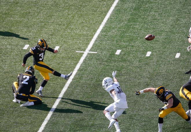 Iowa place kicker Keith Duncan strikes a kick for a PAT against Northwestern at Kinnick Stadium in Iowa City on Saturday, Oct. 31, 2020.