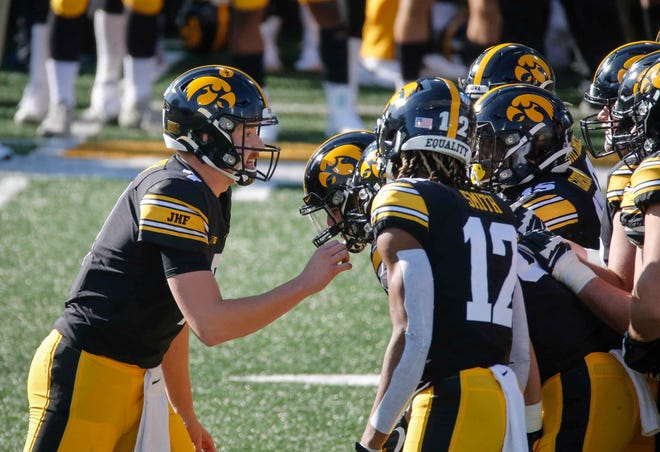 Iowa sophomore quarterback Spencer Petras calls a play in the huddle in the first quarter against Northwestern at Kinnick Stadium in Iowa City on Saturday, Oct. 31, 2020.