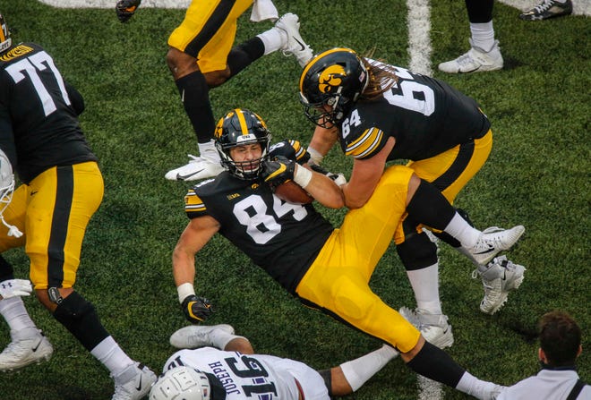 Iowa sophomore tight end Sam LaPorta picks up a first down in the fourth quarter against Northwestern at Kinnick Stadium in Iowa City on Saturday, Oct. 31, 2020.