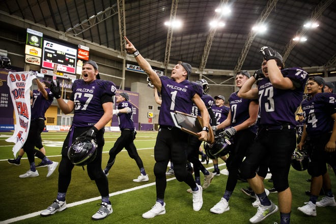OABCIG's Cooper Dejean (1) points to the Falcon's cheering section after they defeated Van Meter 33-26 in the final minutes of their class 1A state football championship game on Friday, Nov. 20, 2020, in Cedar Falls, IA. OABCIG would go on to defeat Van Meter 33-26.