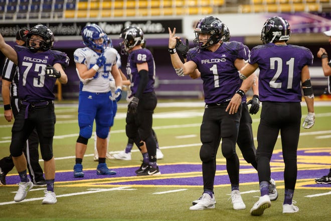 OABCIG's Cooper Dejean (1) gestures "2" for OABCIG's second class 1A state football championship win on Friday, Nov. 20, 2020, in Cedar Falls, IA. OABCIG would go on to defeat Van Meter 33-26.