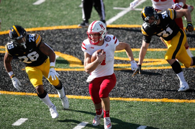 Nebraska quarterback Luke McCaffrey runs the ball in the first quarter against Iowa at Kinnick Stadium in Iowa City on Friday, Nov. 27, 2020.