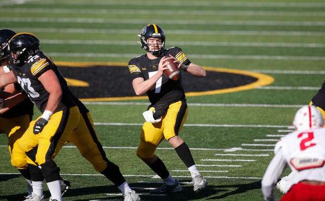 Iowa sophomore quarterback Spencer Petras looks for an open receiver in the second quarter against Nebraska at Kinnick Stadium in Iowa City on Friday, Nov. 27, 2020.
