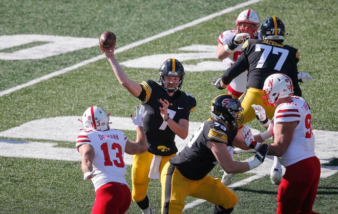 Iowa sophomore quarterback Spencer Petras fires a pass in the first quarter against Nebraska at Kinnick Stadium in Iowa City on Friday, Nov. 27, 2020.