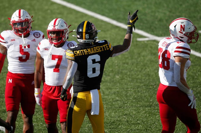 Iowa receiver Ihmir Smith-Marsette signals first down after pulling down a reception in the first quarter against Nebraska at Kinnick Stadium in Iowa City on Friday, Nov. 27, 2020.